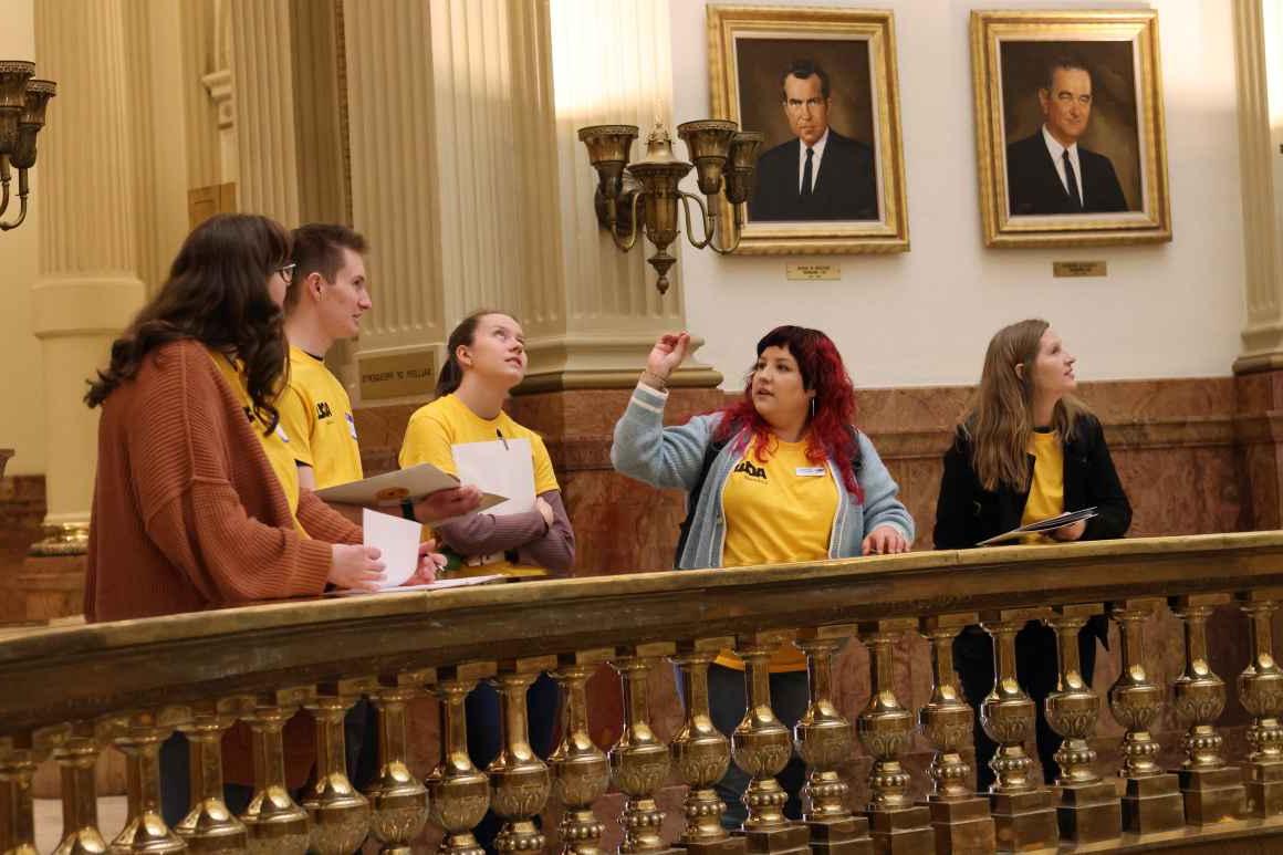Lobby Leader Kassandra, leading LIFT attendees on a tour of the Colorado Capitol building